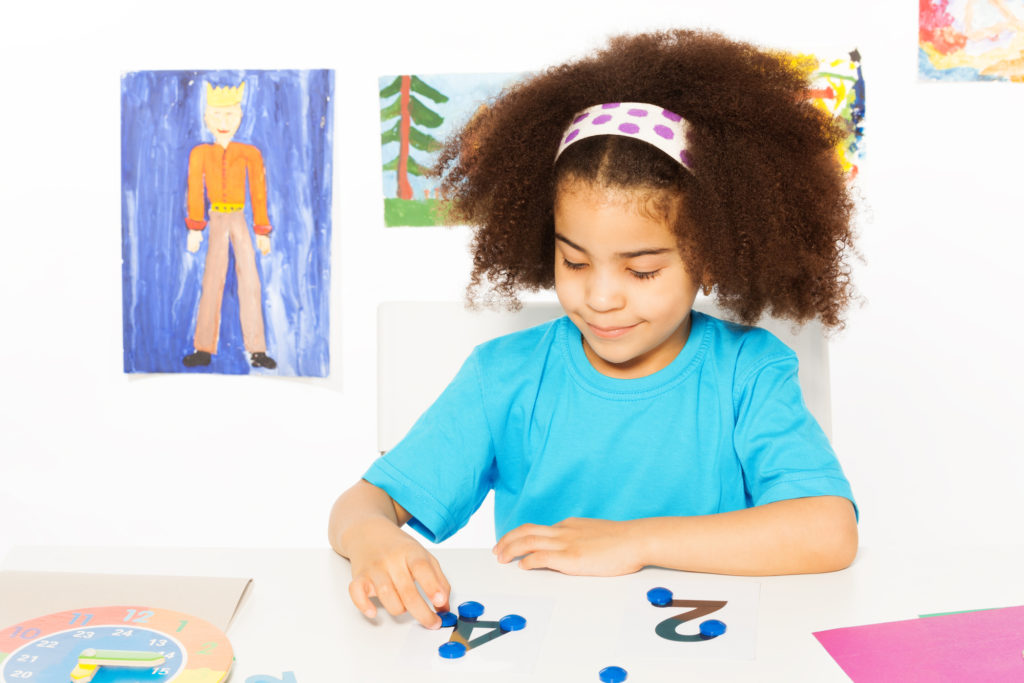 Girl counting dots and numbers